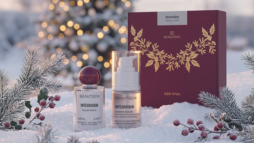 Cofanetto regalo Scent Ritual Integraskin Christmas Edition di Beautech con profumo Scent Vibe e Vitamin Serum 15 ml, immersi nella neve tra rami di pino, bacche rosse e luci natalizie.